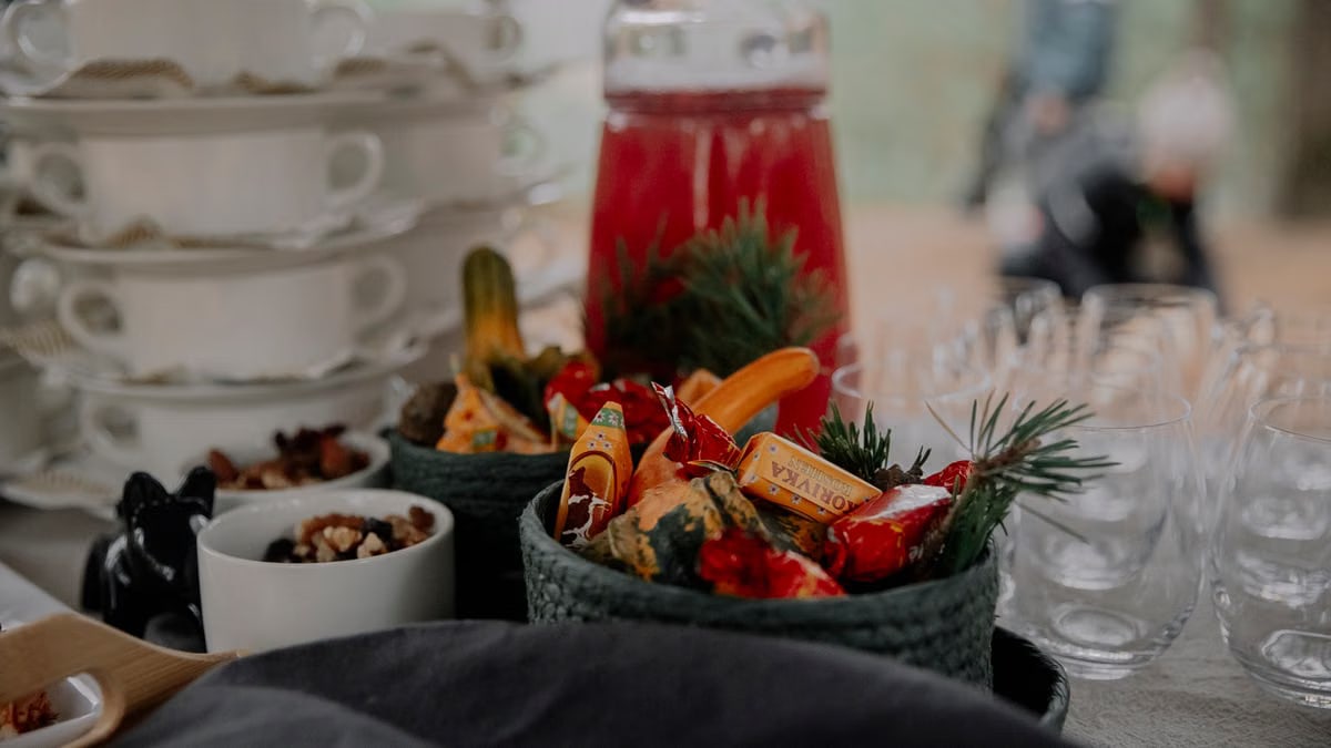 A beautifully arranged table with festive candies and glassware, perfect for a holiday gathering.